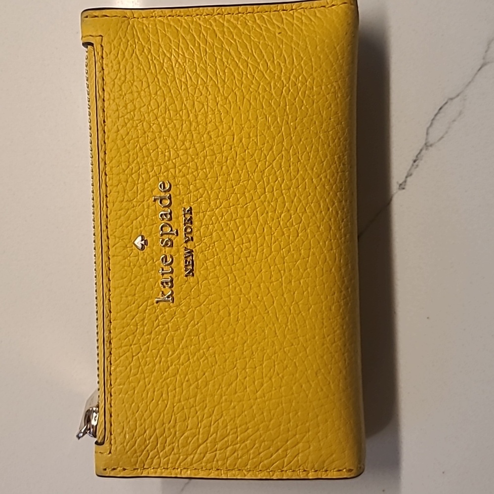 Kate Spade bi-fold yellow wallet